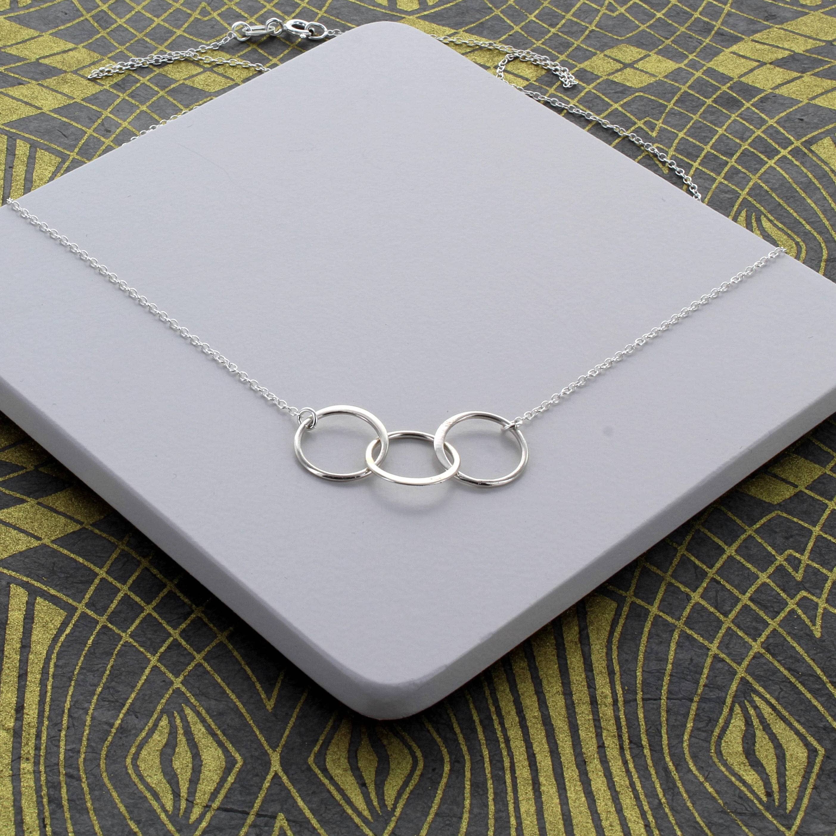 Triple infinity best sale necklace