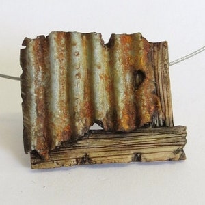 faux corrugated rust effect polymer clay pendant