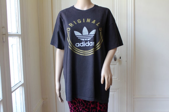 black white and gold adidas shirt