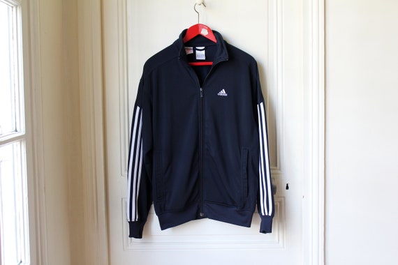 white adidas jacket with blue stripes