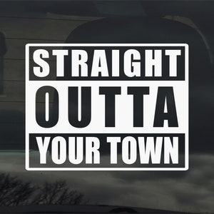 May include: White vinyl decal with black text that reads "Straight Outta Your Town".