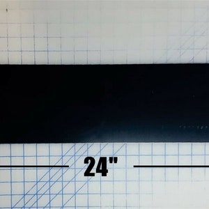 May include: A black rectangular mouse pad measuring 24 inches by 6 inches.