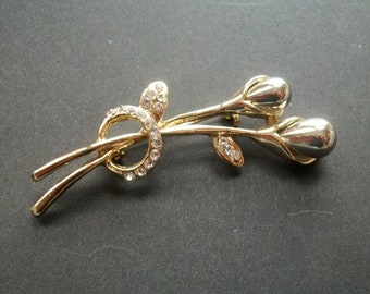 True vintage large solid brooch flower branch with buds and rhinestones gold plated