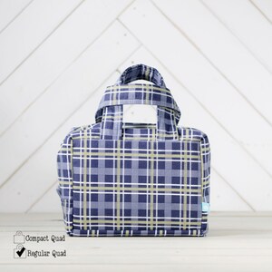 May include: A blue and yellow plaid tote bag with two handles. The bag is a regular size.