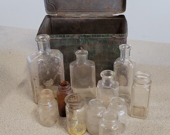 11 Antique Small Medicine Bottles in a Antique Metal Box