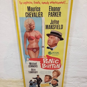 May include: A vintage movie poster for the film "Panic Button" starring Jayne Mansfield, Eleanor Parker, and Maurice Chevalier. The poster features a yellow background with a red and white title and a black and white image of the actors.