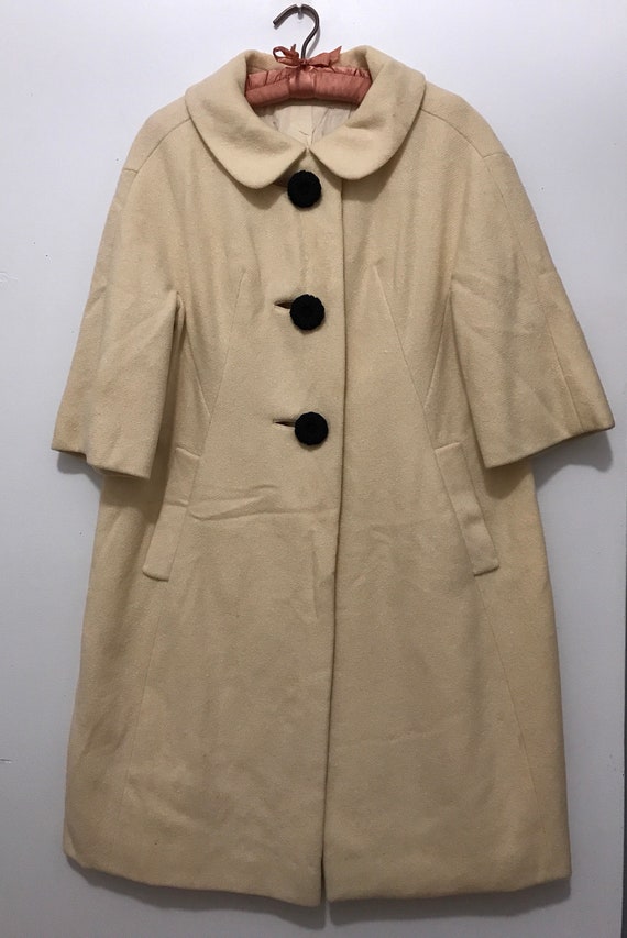 cream swing coat