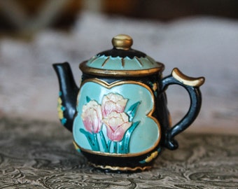 Decorative vintage tea pot with tulips