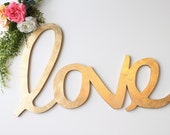 Wedding Love Sign: oversized gold leaf "love" calligraphy sign