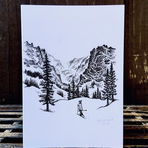 Tarjeta de felicitación con raquetas de nieve en las Montañas Rocosas