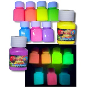May include: Set of eight glow-in-the-dark paint bottles. The bottles are labelled "Zuper Paint Glowz". The paint is shown glowing in the dark.