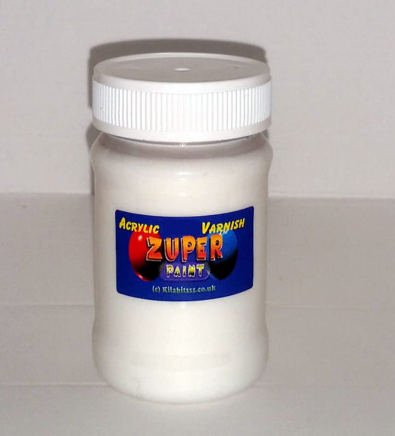 May include: A white jar of acrylic varnish labeled "ZUPER PAINT" with red and blue circles around the word "ZUPER".