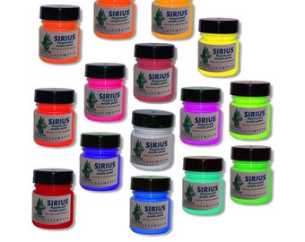 May include: A set of 14 small bottles of fluorescent acrylic paint in various colors, including orange, yellow, green, pink, purple, blue, red, and white. Each bottle has a black lid and a label that says "SIRIUS Fluorescent Acrylic Paint".