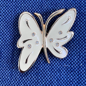 Vintage cream enamel butterfly brooch