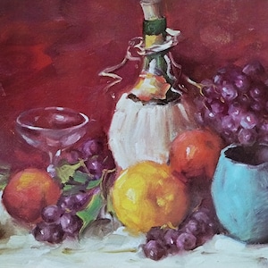 May include: An oil painting of a still life featuring a wine bottle, a glass, a blue pitcher, and various fruits. The fruits include grapes, oranges, and a lemon. The background is a deep red color, and the painting has a classic, rustic feel.