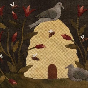May include: A brown felt wall hanging with a beehive, two doves, and red flowers. The beehive is yellow and has a small entrance. The doves are perched on the beehive and the flowers are in bloom.