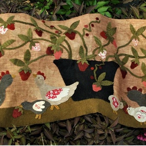 May include: A brown felt wall hanging with a green and red strawberry plant, a black pot, and four gray chickens with red accents.