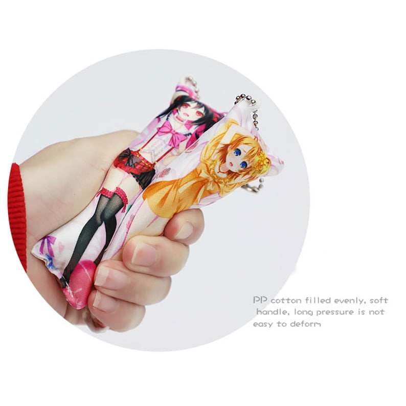 May include: A colorful keychain featuring two anime characters. The keychain is made of soft, plush fabric and has a metal ring for attaching to keys or bags.
