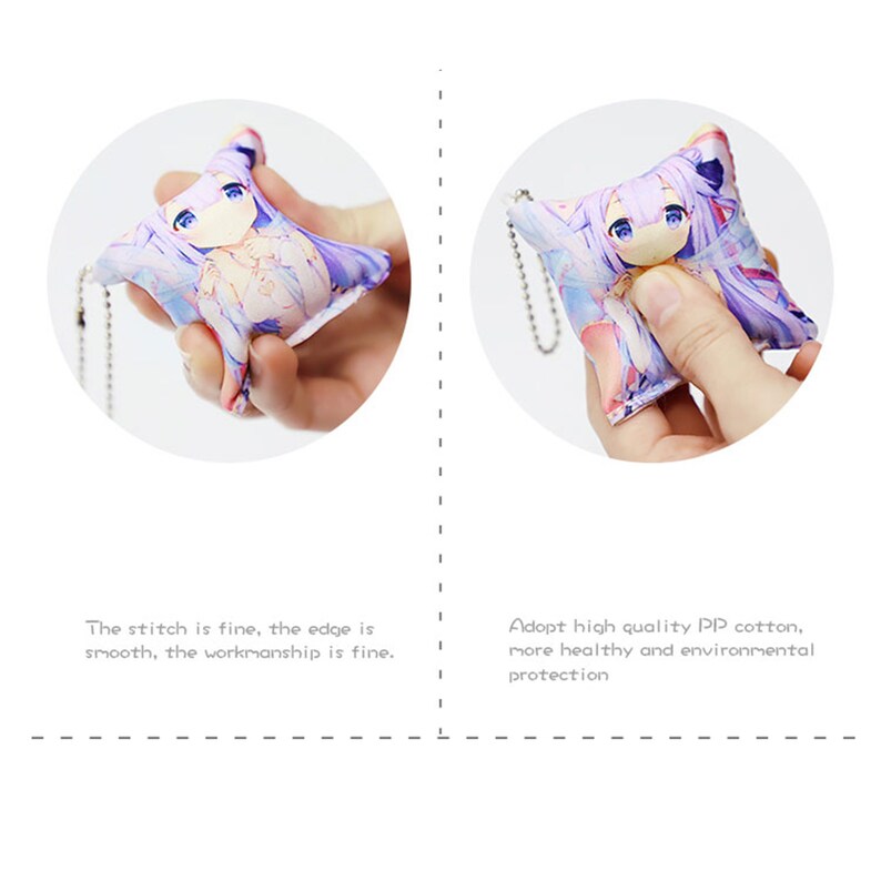 May include: A purple and white anime character keychain with a soft, plush texture. The keychain is attached to a silver chain.