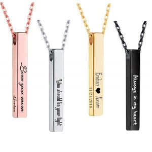 Puede incluir: Tres collares de barra plateada con grabados personalizados. Los collares son de oro rosa, plata y negro. Los grabados dicen "Love you mom Jordan", "You should be your light" y "Eridian Xavier 11/27/2018" con un símbolo de corazón.