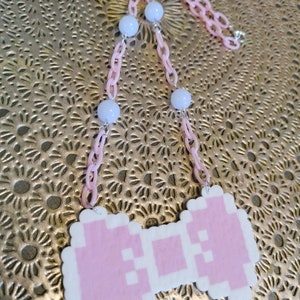 Customizable bow necklace with pastel resin beads and plastic chain for kawaii, creepy cute, lolita, fairy kei or decora