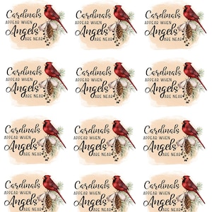 May include: Sheet of stickers featuring a red cardinal perched on a pinecone with the text "Cardinals Appear When Angels Are Near" in black script. The background is a soft, watercolor-style wash.