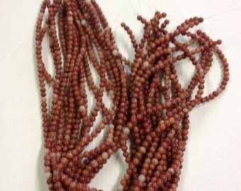 Genuine Cork red MARBLE 6mm drilled thru beads  X 65 Guaranteed Irish