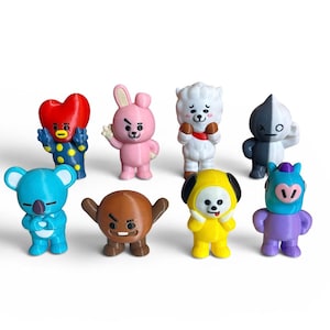May include: A set of eight brightly coloured character figurines. Each figure has a distinct design and colour, including blue, pink, yellow, and brown. The figurines are standing and appear to be made of plastic.