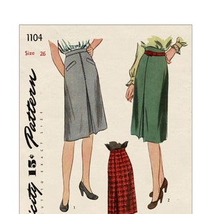 May include: Vintage Simplicity sewing pattern number 1104, size 26, for a skirt. The pattern shows three different styles of skirts: a grey skirt with a centre front pleat, a green skirt with a centre front pleat, and a red plaid skirt with a centre front pleat.