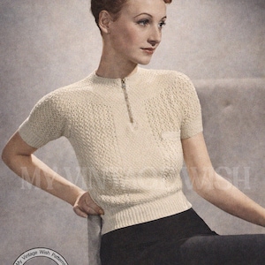 May include: Cream-coloured vintage knitted top with a short zip and short sleeves. Designed to fit a 81-86 cm bust. The image includes the text "Retro Knitting" and "My Vintage Wish Patterns".