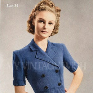 May include: A blue knitted short-sleeved jacket featuring a double-breasted front, notched lapels, and four dark buttons. The pattern cover text reads Weldons Leaflet No. 269 Trim Little Middy-Jacket With Double-breasted Fronts 8 ozs. 3-ply Bust 34.