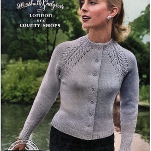 May include: A vintage knitting pattern leaflet for a light gray cardigan with a button-up front and lace detailing on the shoulders. The leaflet is titled "Leaflet N° 55" and states that the cardigan is designed to fit a 34, 36, or 38 inch bust.