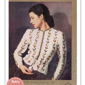 May include: A vintage knitting pattern for a white cardigan with colorful floral embroidery. The pattern is for a 34 inch bust and is made with Patons Beehive Fingering 3-ply yarn. The pattern is from P&B Wools.