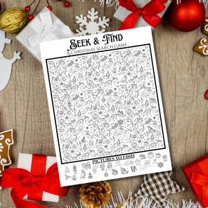 May include: A black and white Christmas search game titled "Seek & Find" with the text "A Christmas Search Game". The game features numerous small Christmas-themed illustrations. The game is surrounded by Christmas decorations, including gifts and baubles.