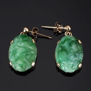 9ct gold Jadeite earrings; post studs with carved apple green Jade