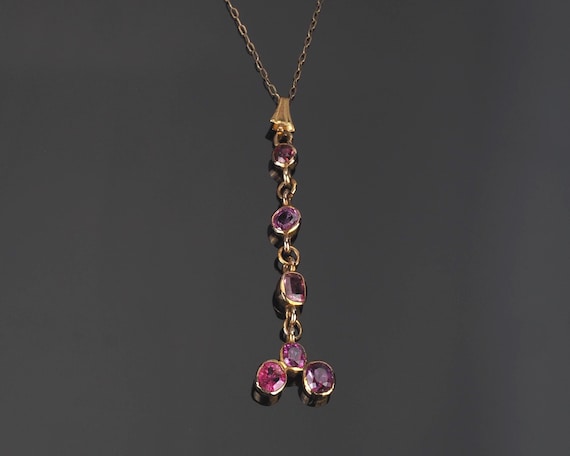 Antique ruby necklace; pendant on 9ct gold chain; natural Rubies