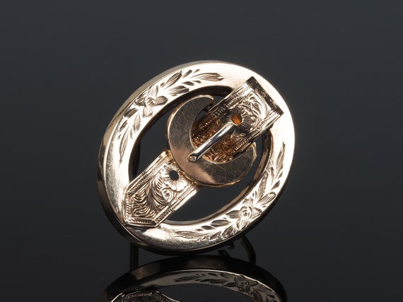 Buckle brooch deals