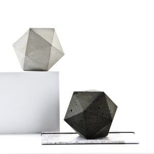 hand cast concrete icosahedron sculpture in dark or pale grey