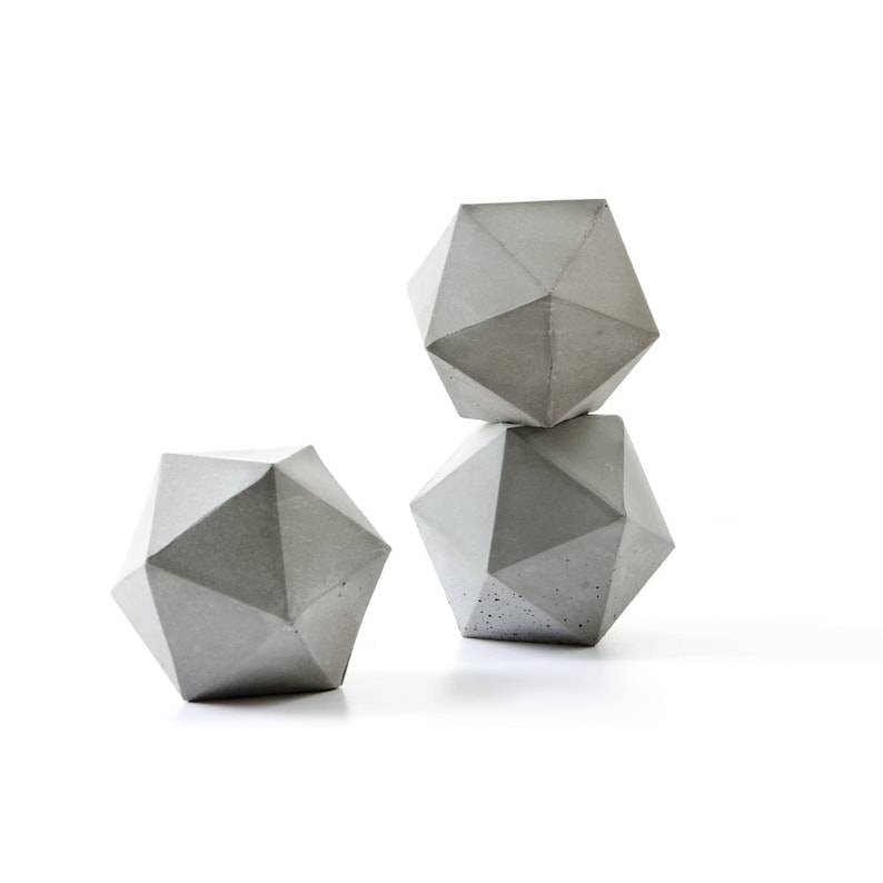 pale grey concrete icosahedron sculpture