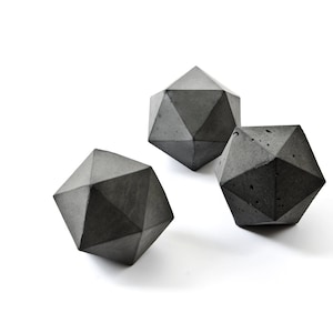 dark grey concrete icosahedron sculpture