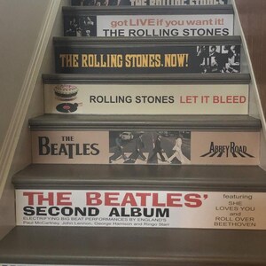 May include: A staircase with risers decorated with classic rock album covers. Visible titles include The Rolling Stones' Got Live If You Want It!, The Rolling Stones, Now!, Let It Bleed, and The Beatles' Abbey Road and The Beatles' Second Album.