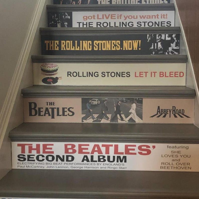 May include: A staircase with risers decorated with classic rock album covers. Visible titles include The Rolling Stones' Got Live If You Want It!, The Rolling Stones, Now!, Let It Bleed, and The Beatles' Abbey Road and The Beatles' Second Album.