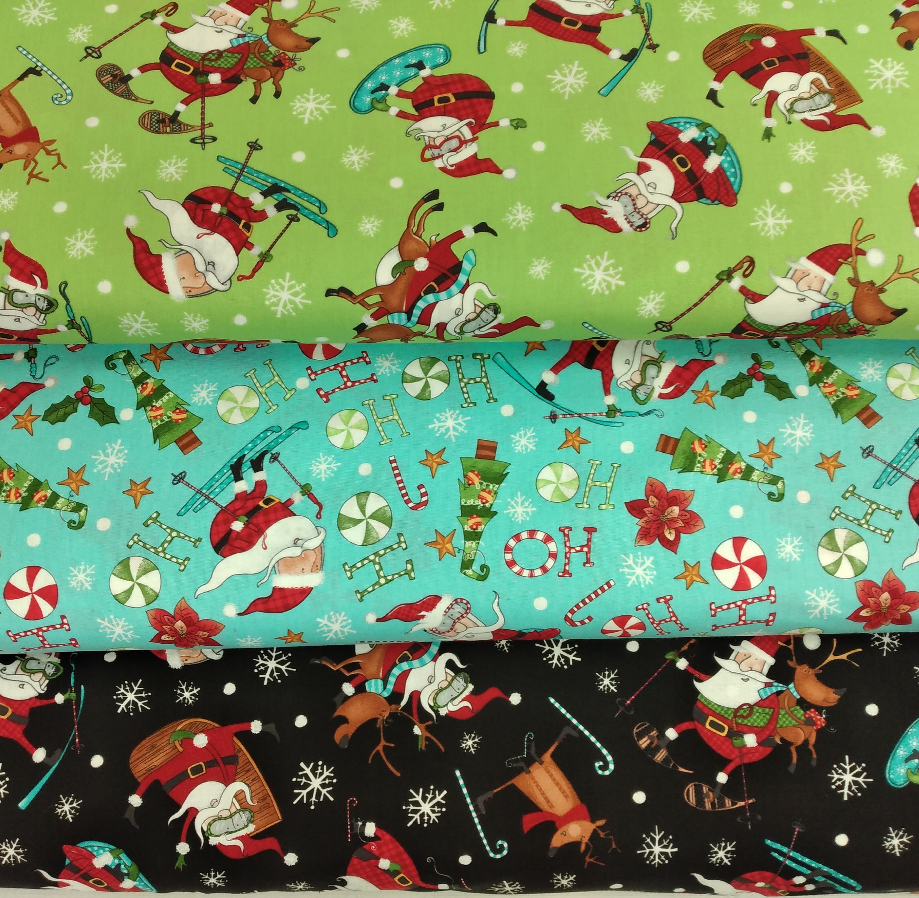 Extreme Santa from Northcott, 100% Quilters Cotton by the Yard, Minimum 2 Yard Purchase, 3 Coordinating fabrics