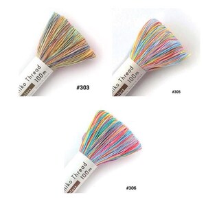 May include: Three skeins of multicolored embroidery thread labeled Miko Thread 100m. The skeins are numbered #303, #305, and #306. Each skein features a blend of pastel and vibrant hues including pink, blue, yellow, and green strands bundled together.