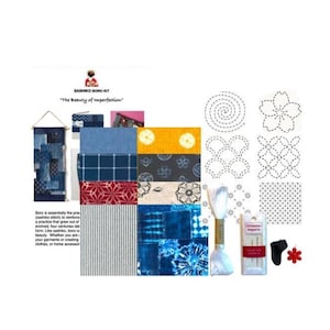 May include: A Sashiko Boro kit featuring various fabric swatches in blue, white, yellow, and red patterns, a printed instruction sheet with the text "SASHIKO BORO KIT The Beauty of Imperfection," a spool of white thread, a needle pack, and a red flower thimble.