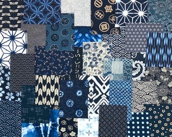 May include: A collection of various fabric swatches featuring indigo blue and white patterns. The designs include geometric shapes, floral motifs, dragonfly silhouettes, polka dots, waves, and traditional Japanese-inspired textile prints.