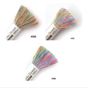 May include: Three bundles of multicolored embroidery thread labeled Miiko Thread 100m. The bundles are identified by numbers #303, #305, and #306, each featuring a vibrant mix of pastel and bright variegated strands arranged in a fan-like shape.