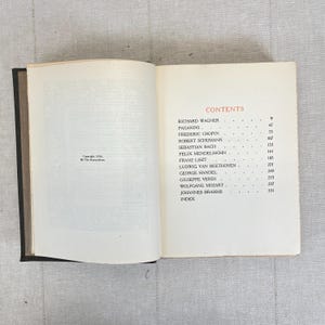May include: Open book displaying the contents page of a book. The page lists composers such as Richard Wagner, Frederic Chopin, and Ludwig van Beethoven. The text is in black font on a cream-colored page.