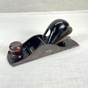 May include: A set of three ceramic mugs with a speckled, matte finish. The mugs are in shades of cream, light gray, and dark gray. Each mug has a simple, minimalist design, perfect for coffee or tea.