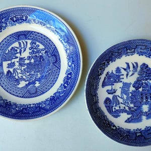 May include: A set of three ceramic mugs with a speckled, matte finish. The mugs are in shades of cream, light gray, and dark gray. Each mug has a simple, minimalist design, perfect for coffee or tea.